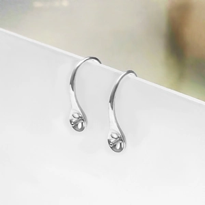 Macro shot of silver earring hooks with water drop base for DIY pearl jewelry making