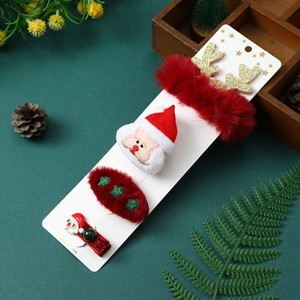 Detailed set of Christmas hair clips and scrunchies with Santa and reindeer motifs