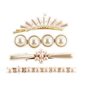 Elegant 4-piece golden hair clip set with pearls and rhinestones on white background