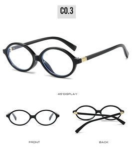 Detailed view of black oval sunglasses with gold triple square rivets and blue light lens