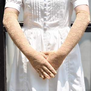 Detailed view of long champagne floral lace UV protection gloves for elegant sun protection
