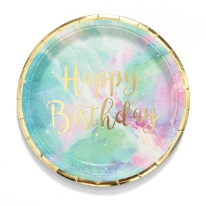 Detail of a round marble paper plate with gold Happy Birthday foil text and border