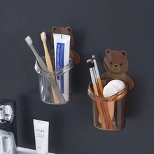 Adhesive wall-mounted storage cups with cartoon bear design for toothbrushes and toothpaste