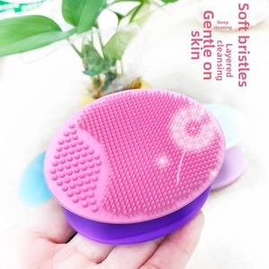 Macro shot of soft pink silicone facial brush with fine bristles for deep pore cleansing