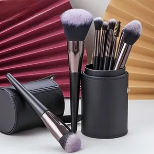 Detail of 10-piece makeup brush set with gradient bristles and black faux leather storage case