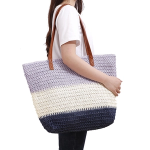 Handwoven beach tote bag featuring purple blue stripes and brown leather handles