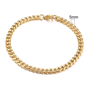 Detail shot showing a 5mm width measurement for this gold Cuban link chain bracelet