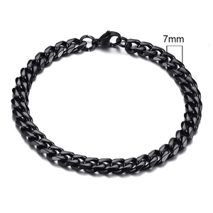 Detail view of 7mm black Cuban link chain bracelet with polished stainless steel finish