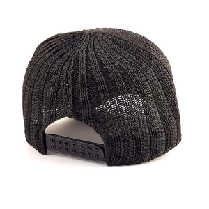 Detail of black knitted baseball cap showing woven texture and snapback adjustment
