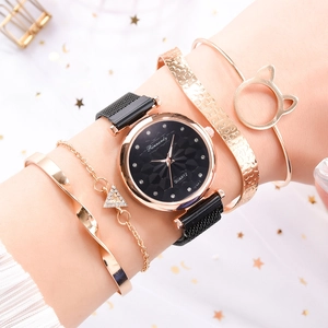 Close-up of magnetic mesh watch with cat-ear bracelet and floral accent jewelry set
