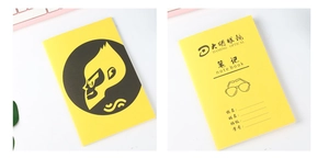 Detail of yellow A5 notebook showing front monkey logo and back student info layout