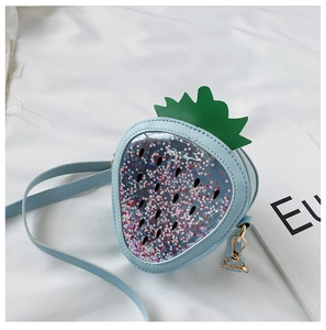 Detail of light blue strawberry sequin crossbody bag with star glitter and gold hardware
