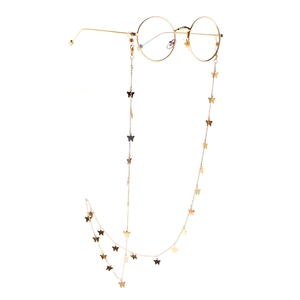 Elegant gold butterfly eyewear chain with stylish round glasses on a white background
