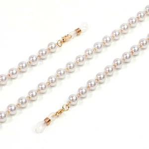 Detail of white pearl eyeglass chain with gold lobster clasp and silicone loops
