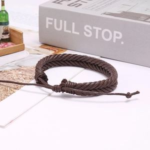 Macro detail of dark brown hand-woven wax cord bracelet with adjustable knot design