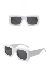 Front and side views of vintage white rectangular sunglasses with dark gray lenses