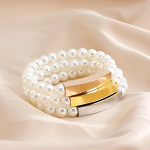 Elegant triple-layer pearl bracelet with gold, silver and rose gold metallic accent bars