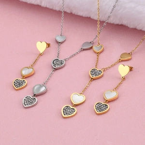 Elegant heart-shaped titanium steel jewelry set with diamonds and seashell inlays