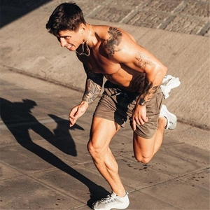 Detail of grey-brown sports shorts with adjustable drawstring waist for athletic training