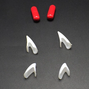 Halloween vampire teeth set with 4 white fangs and 2 red blood capsules for cosplay