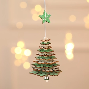 Detail of wooden Christmas tree ornament with star top and bell in festive green and natural wood