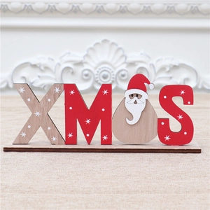 Detail of wooden XMAS letter sign with Santa Claus character and star patterns