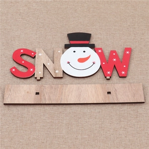 Macro view of SNOW wooden Christmas sign with snowman head and sturdy base stand