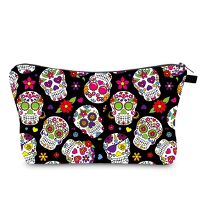 Detailed view of water-resistant fabric and colorful sugar skull print on travel bag