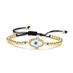 Adjustable Hamsa Hand and Evil Eye gold beaded bracelet with black woven cord