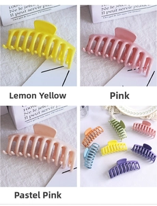 Macro detail of large matte candy-colored hair claw clips with strong grip teeth