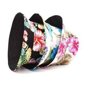 Selection of double-sided cotton bucket hats with colorful tropical hibiscus flower prints