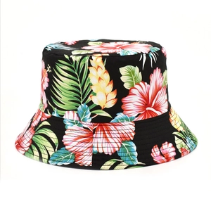 Close-up of tropical hibiscus floral print on a double-sided black cotton sun bucket hat