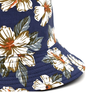 Navy blue reversible fisherman hat with tropical flower print and reinforced brim stitching