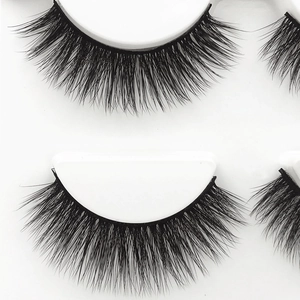 Dramatic 3D thick false eyelashes for volume and length on a clean white background