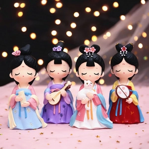 Detailed view of four Dunhuang flying fairy resin figurines in Tang style clothing