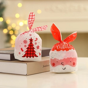 Christmas rabbit ear gift bags featuring Santa Claus and Xmas tree patterns on books