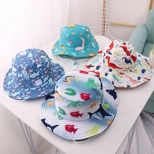 Kids sun hats featuring ocean and dinosaur prints with adjustable chin straps for safety