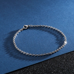 Polished titanium steel O-chain bracelet with lobster clasp on a dual-tone background
