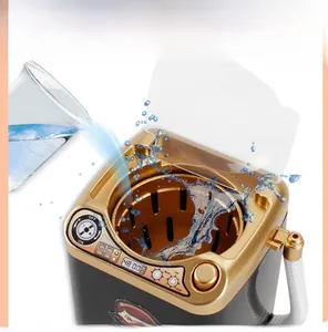 Macro view of water splashing inside black mini toy washing machine with digital display