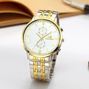Detail of ORLANDO quartz watch showing the white dial with gold markers and two-tone band