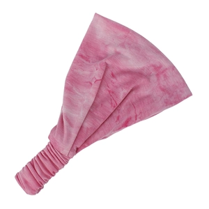 Close-up of pink tie-dye elastic yoga headband showing pleated back detail and soft fabric