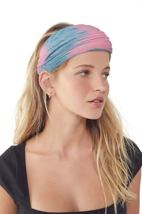 Close-up of a pink and sky blue tie-dye yoga headband worn by a female model