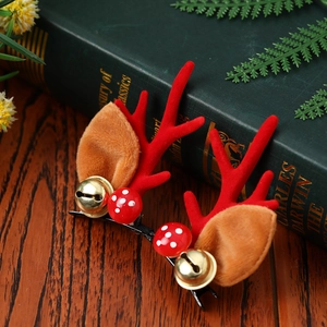 Pinces à cheveux de Noël avec bois de cerf rouges et clochettes dorées sur bois