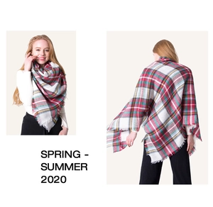 Detail view of large colorful plaid oversized cashmere shawl with elegant fringe edges