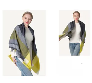 Detail of yellow and grey plaid scarf with soft fringes and woven textile texture