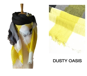 Close-up of yellow and grey plaid scarf fabric texture with detailed fringe tassels