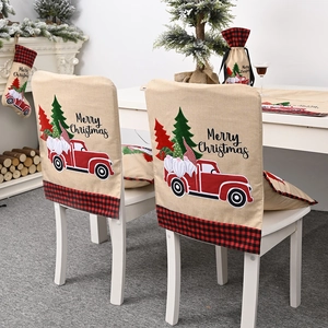 Christmas chair cover featuring red truck and gnome design with plaid trim border