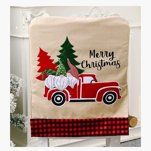 Linen Christmas chair cover featuring red truck, festive gnomes, and Merry Christmas text