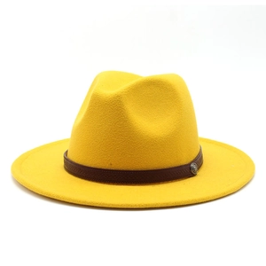 Detail of ginger yellow wool fedora with brown leather band and metallic buckle