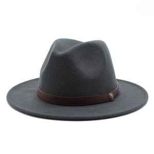 Detail of dark grey fedora hat featuring a brown woven band and vintage metal buckle